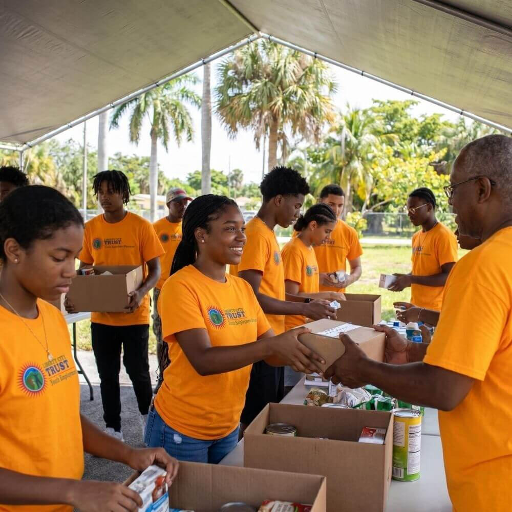 Young residents participating in the Liberty City Trust Youth Employment Program gaining work experience and career skills